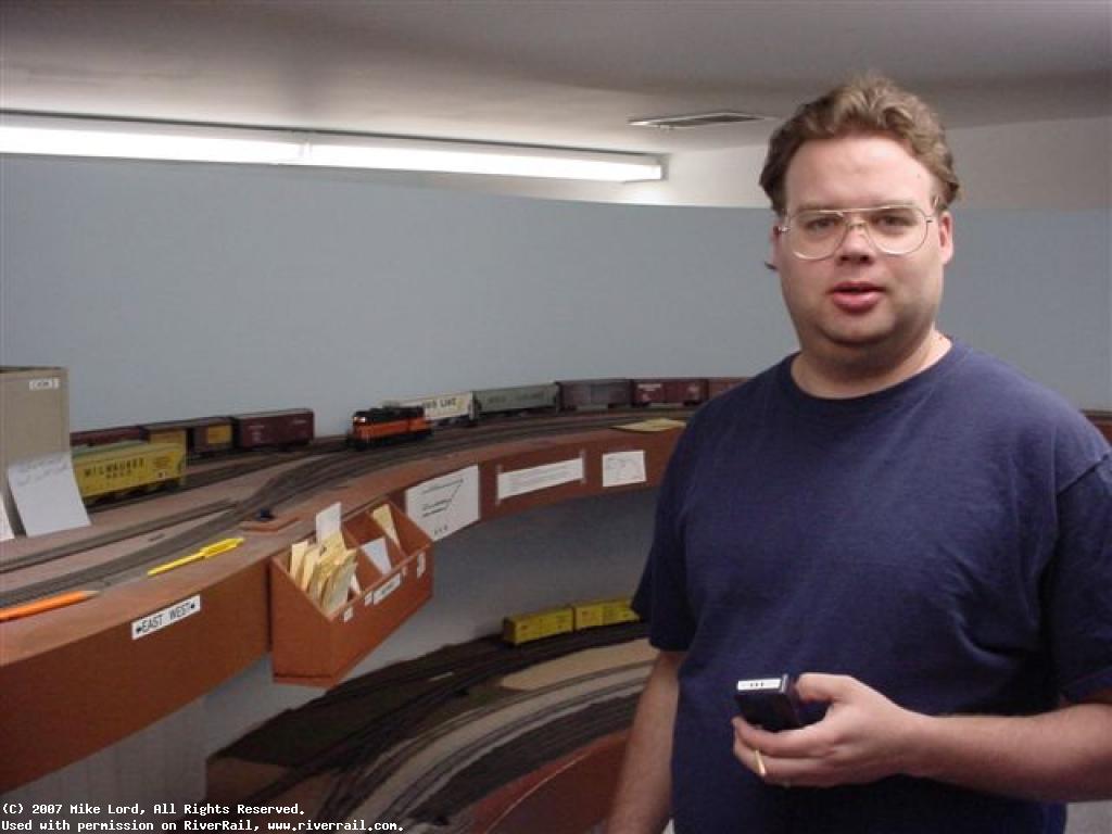 GrandSlambert at the controls of a Model railroad.